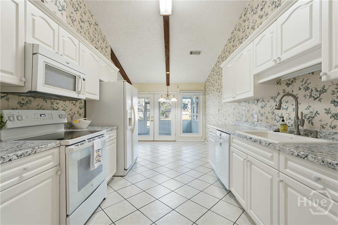 17 Cuttysark Road Savannah, GA 31410 - Photo 16 of 31 Galley kitchen with white appliances