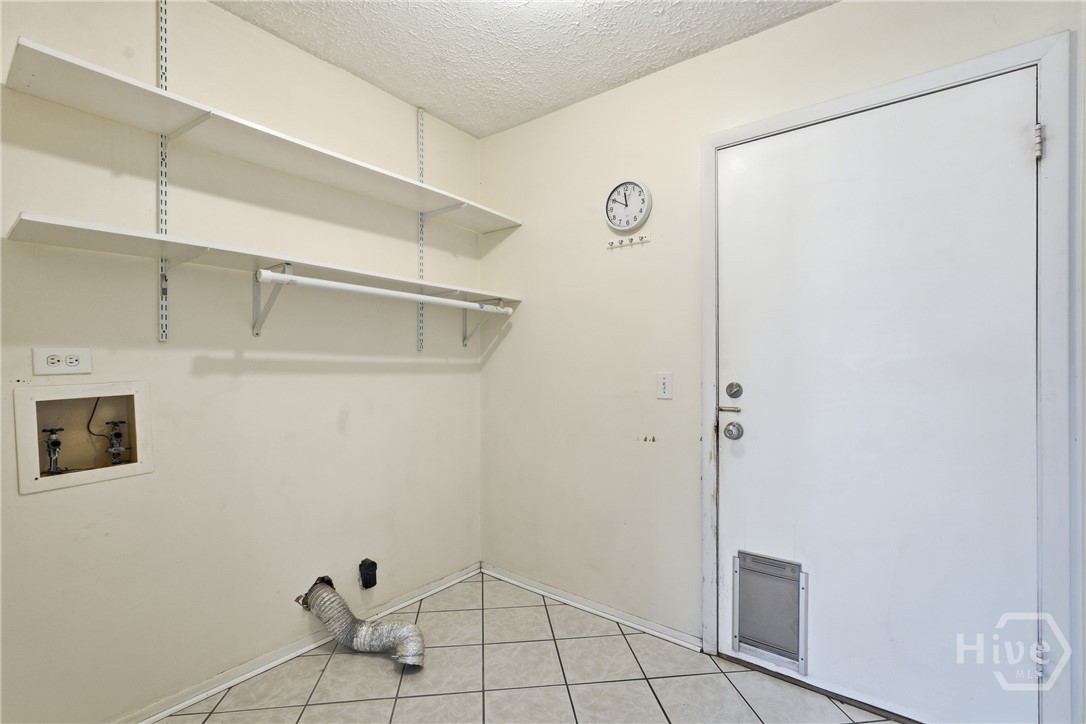 17 Cuttysark Road Savannah, GA 31410 - Photo 17 of 31 Walk thru laundry to garage, tile floors.
