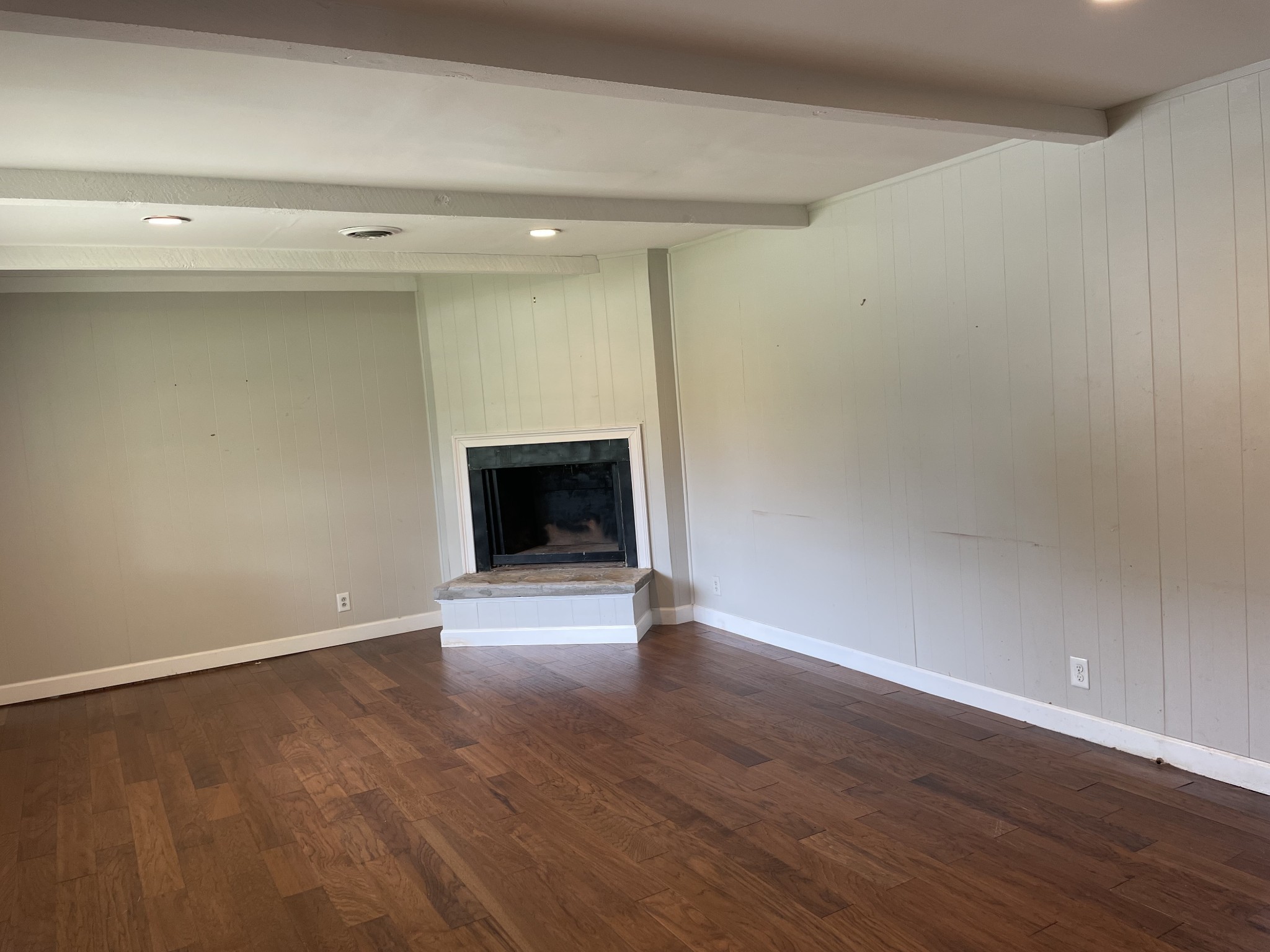 305 Cedar Hill Road Adams, TN 37010 - Photo 11 of 34 a view of an empty room with wooden floor fireplace and a window