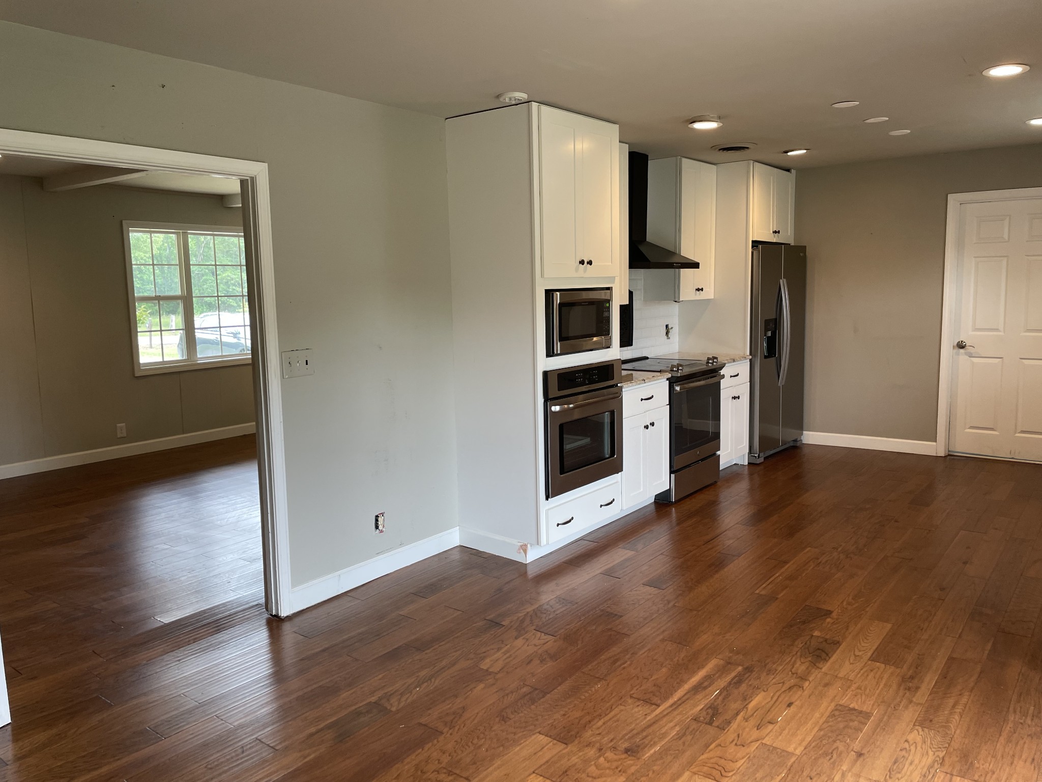 305 Cedar Hill Road Adams, TN 37010 - Photo 14 of 34 a kitchen with stainless steel appliances a refrigerator and a stove top oven