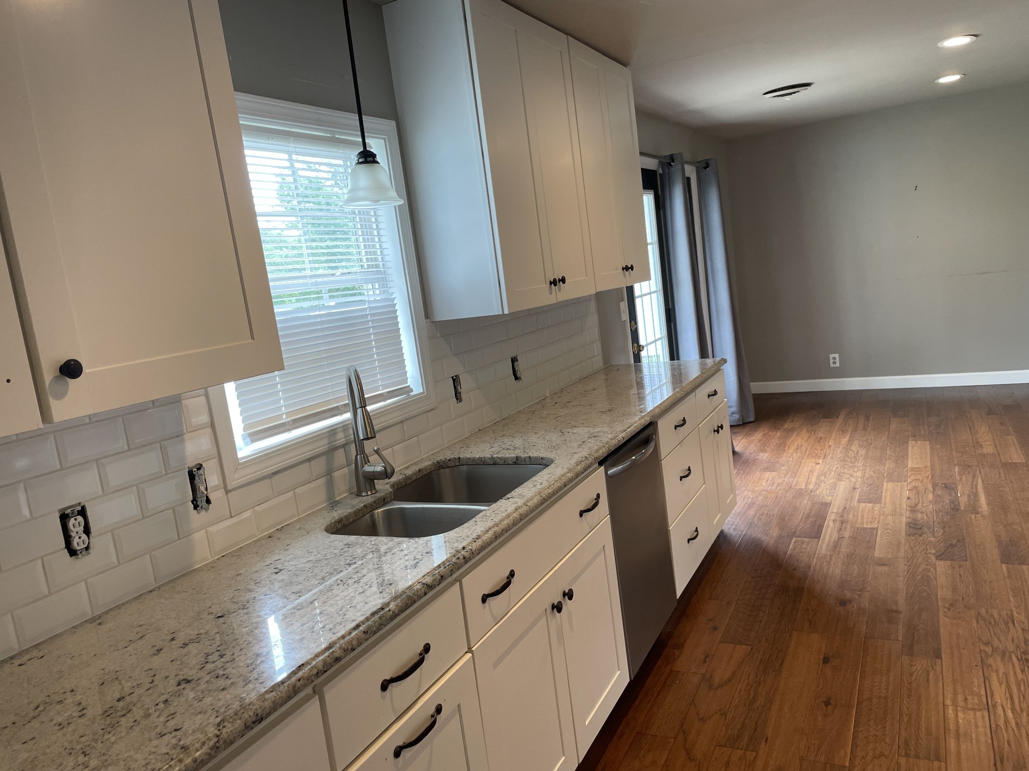 305 Cedar Hill Road Adams, TN 37010 - Photo 18 of 34 a kitchen with stainless steel appliances granite countertop a sink stove and refrigerator