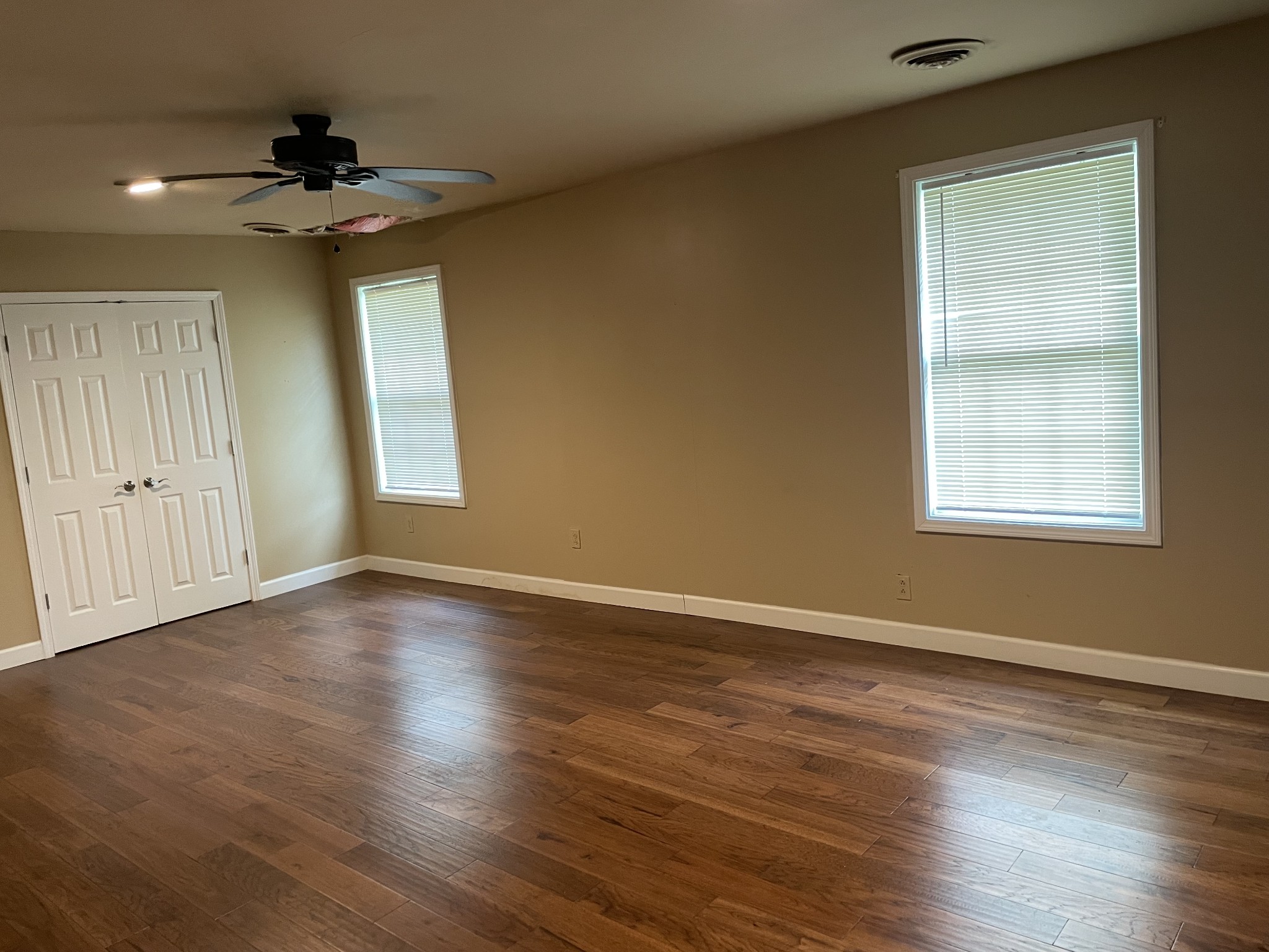 305 Cedar Hill Road Adams, TN 37010 - Photo 22 of 34 a view of an empty room with a window and wooden floor