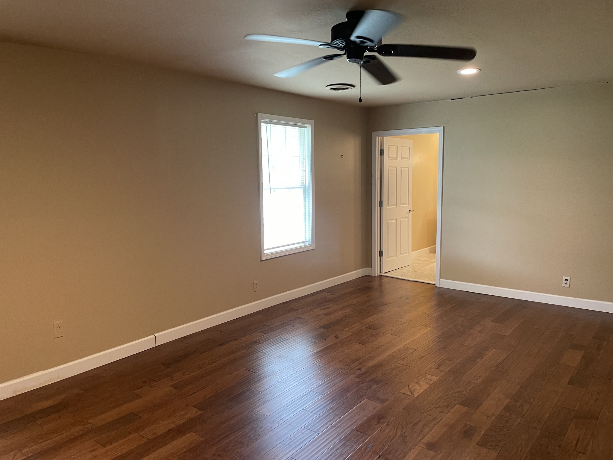 305 Cedar Hill Road Adams, TN 37010 - Photo 24 of 34 a view of empty room with wooden floor and fan