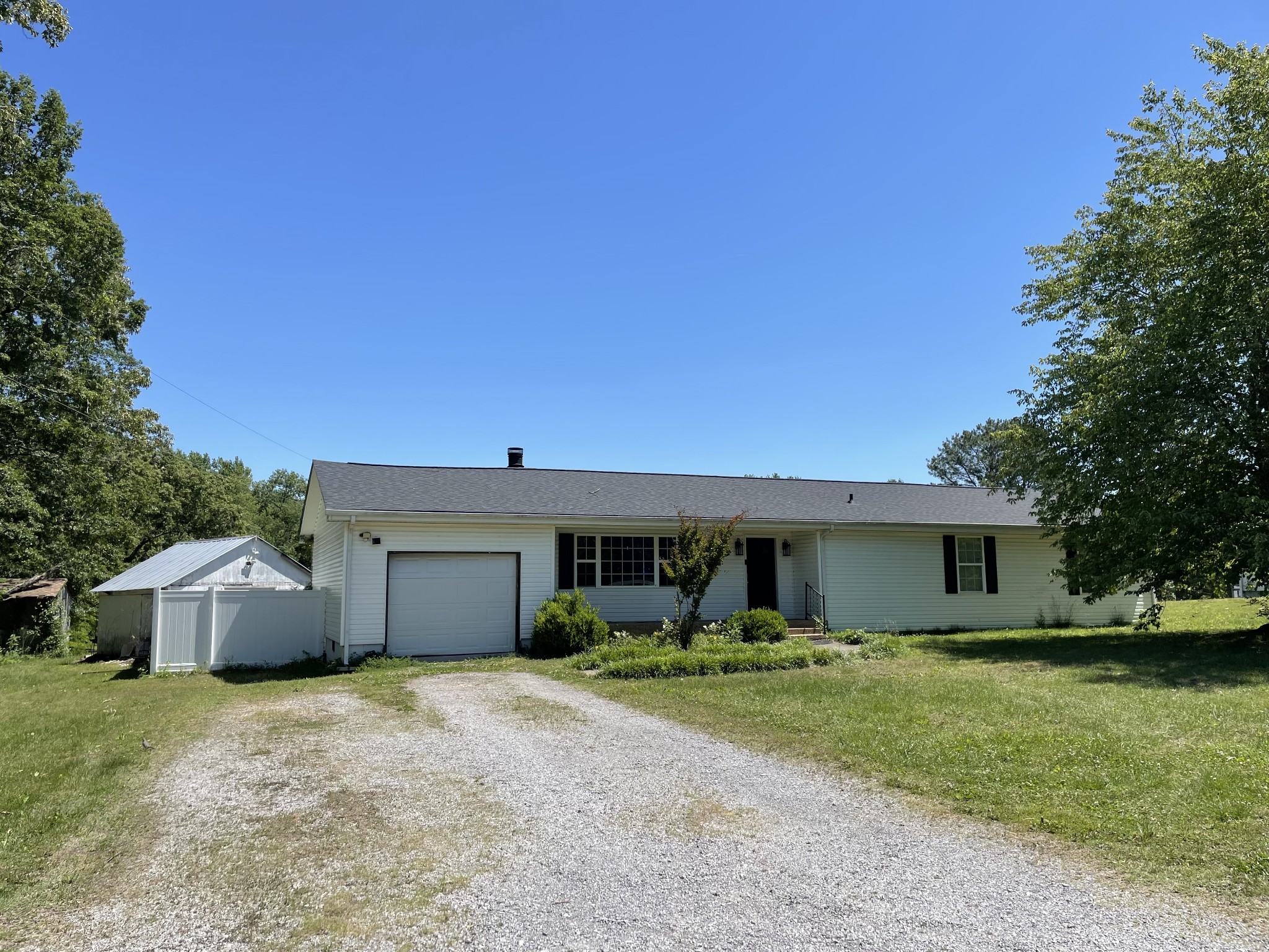 305 Cedar Hill Road Adams, TN 37010 - Photo 3 of 34 a front view of house with a garden