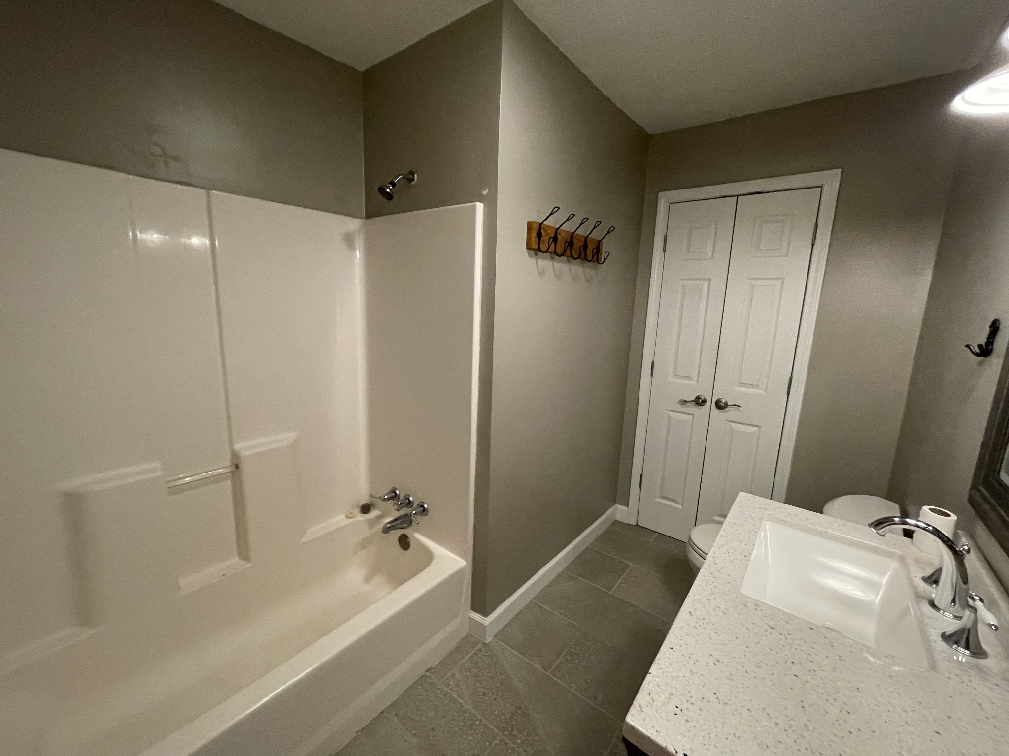 305 Cedar Hill Road Adams, TN 37010 - Photo 32 of 34 a bathroom with a tub and shower
