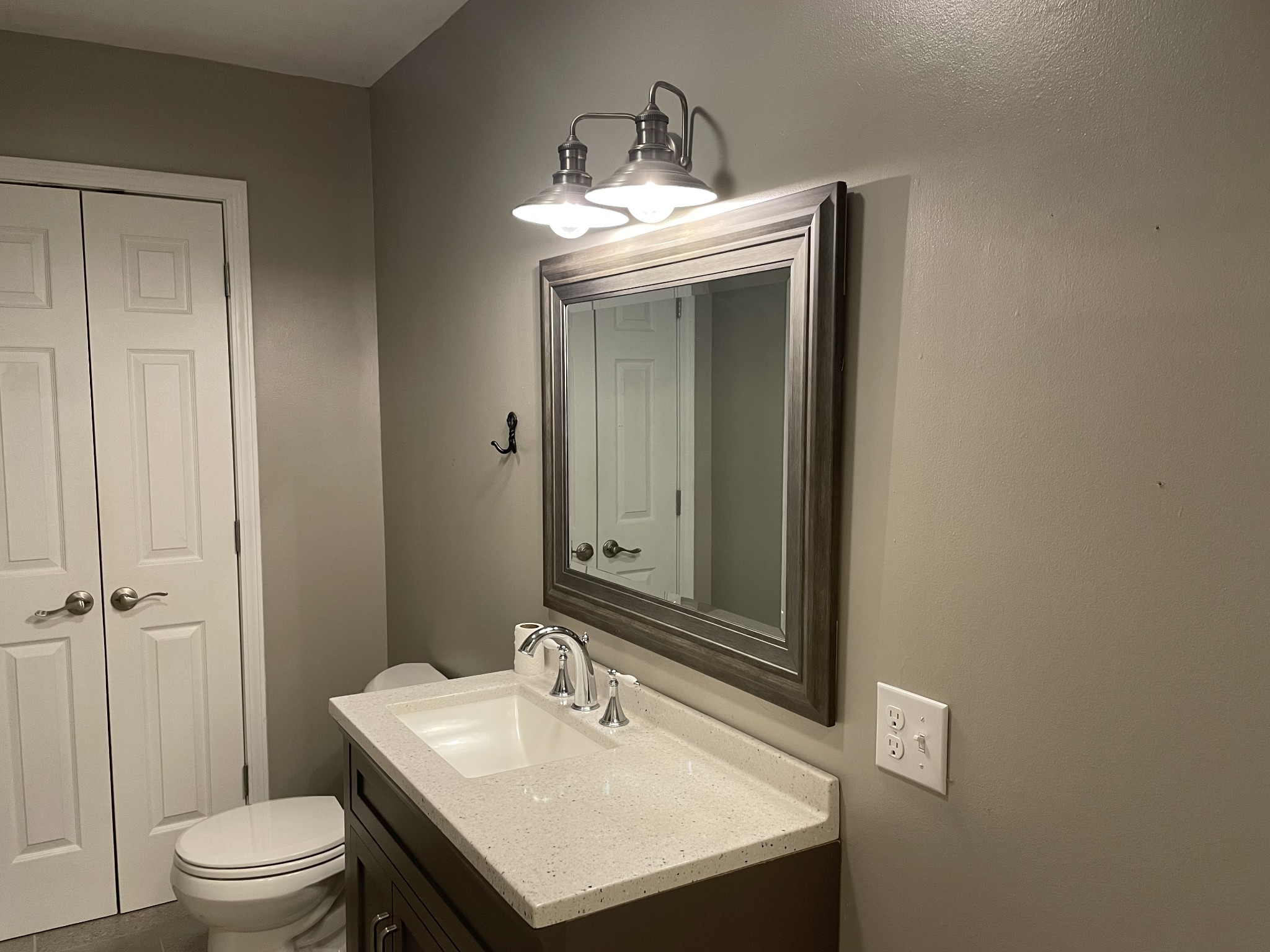305 Cedar Hill Road Adams, TN 37010 - Photo 33 of 34 a bathroom with a sink a toilet and shower