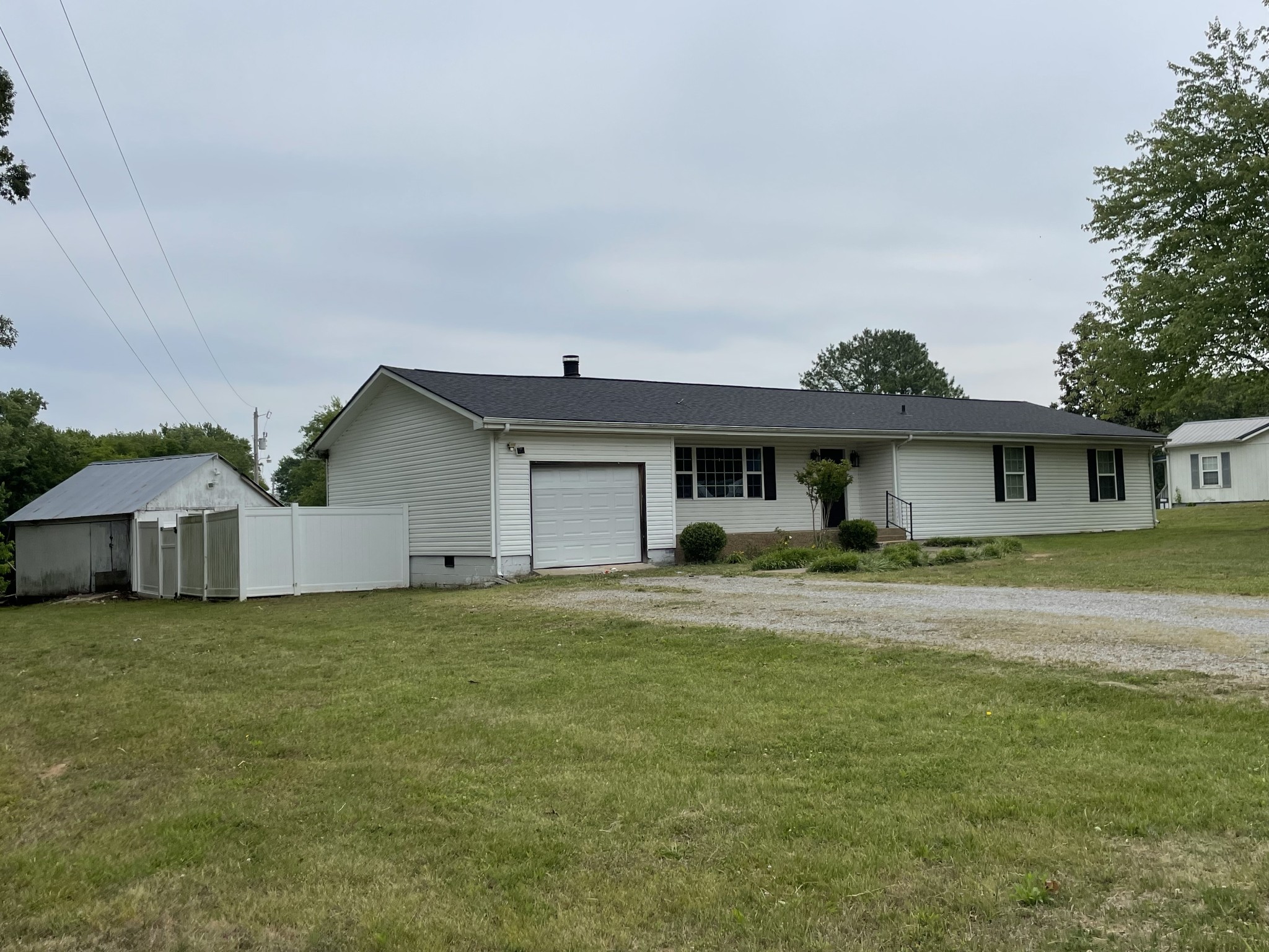 305 Cedar Hill Road Adams, TN 37010 - Photo 4 of 34 a front view of a house with a yard