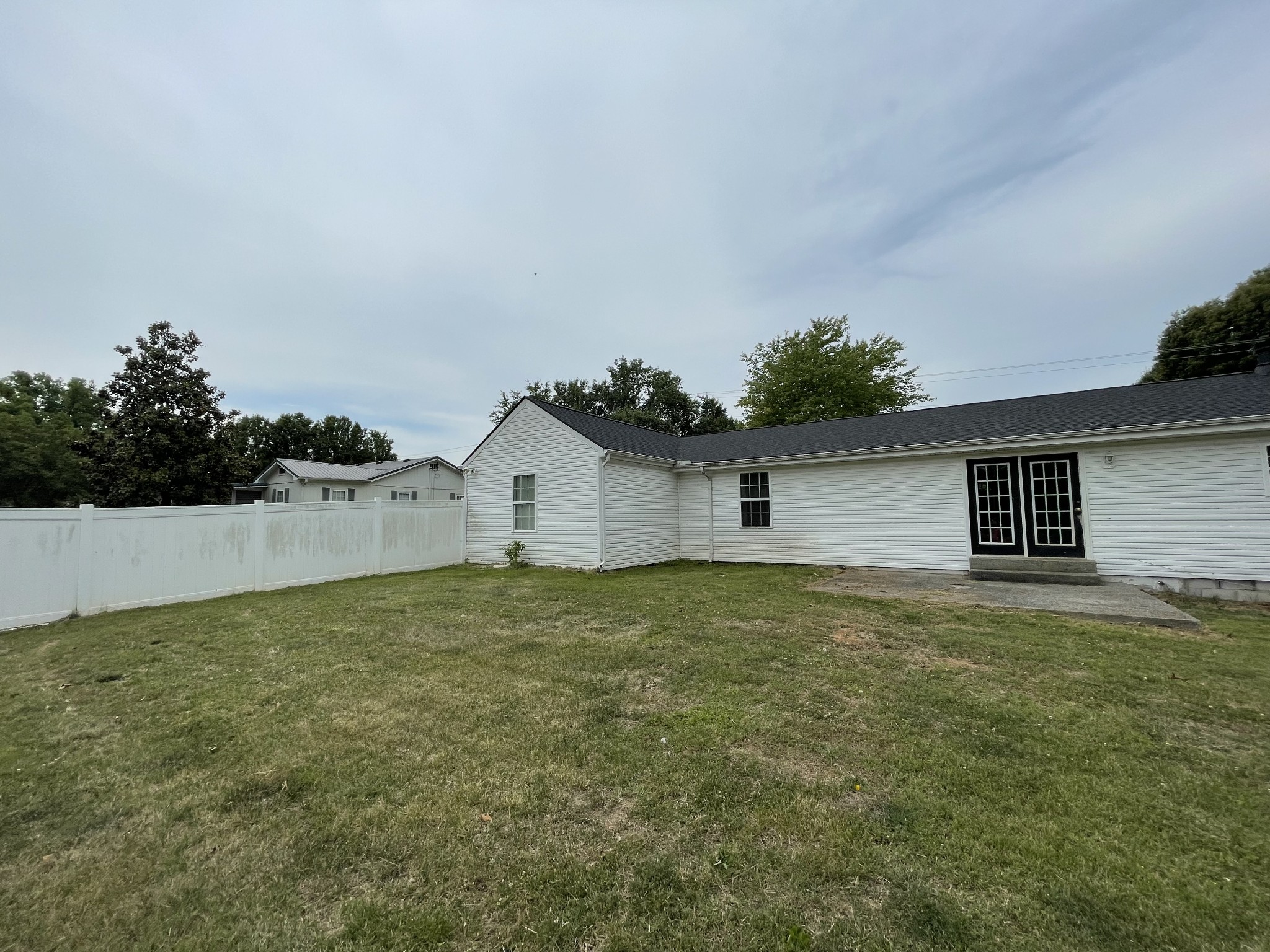 305 Cedar Hill Road Adams, TN 37010 - Photo 5 of 34 a big white house with a yard
