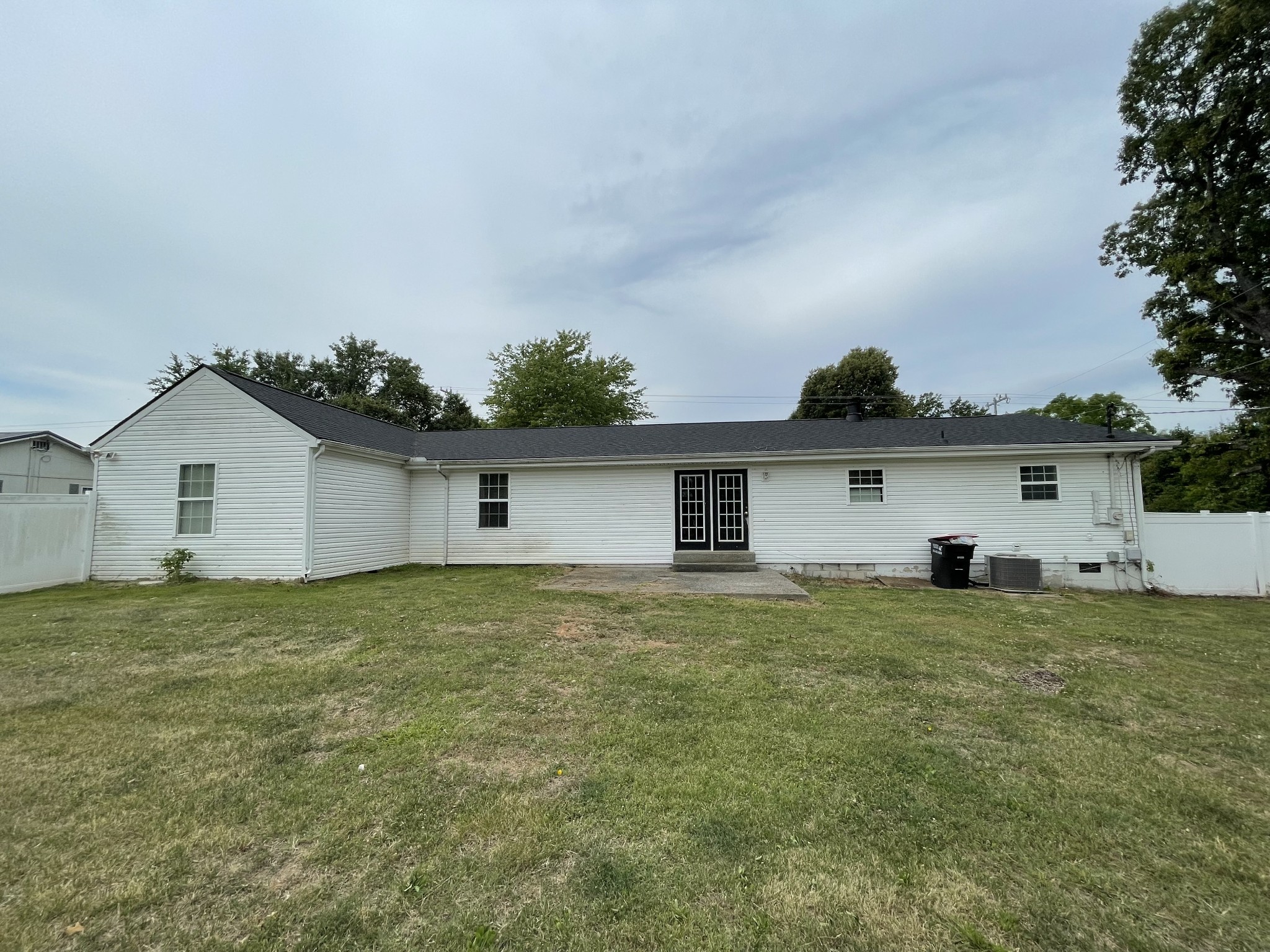 305 Cedar Hill Road Adams, TN 37010 - Photo 7 of 34 a house that is sitting in the grass