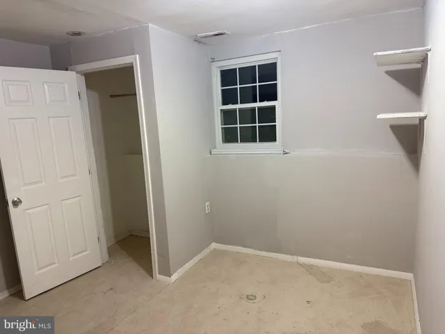 a kitchen with a refrigerator a stove top oven a sink and dishwasher with wooden floor