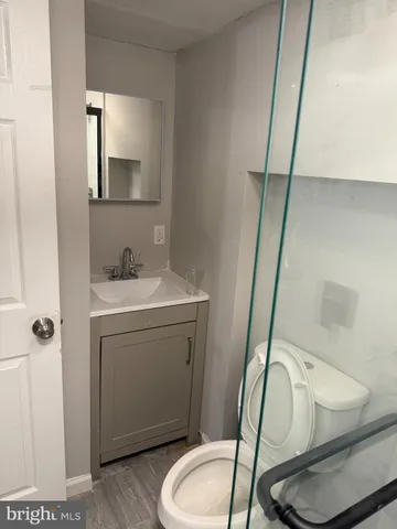 a bathroom with a shower and toilet