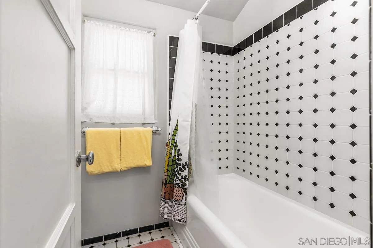 751 G Avenue Coronado, CA 92118 - Photo 19 of 23 a bathroom with a bathtub and shower
