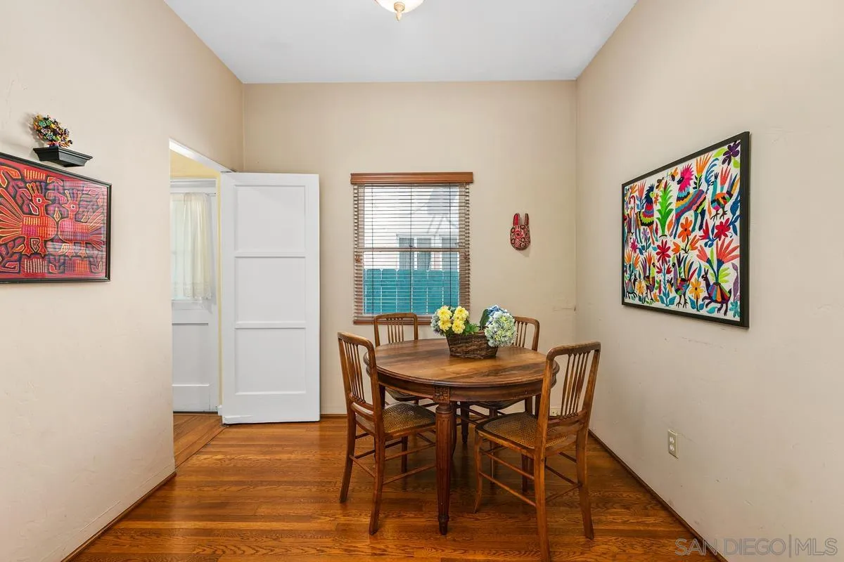 751 G Avenue Coronado, CA 92118 - Photo 7 of 23 a view of a dining room with furniture and wooden floor