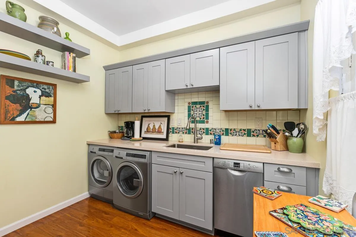 751 G Avenue Coronado, CA 92118 - Photo 9 of 23 a kitchen with a sink a stove and cabinets