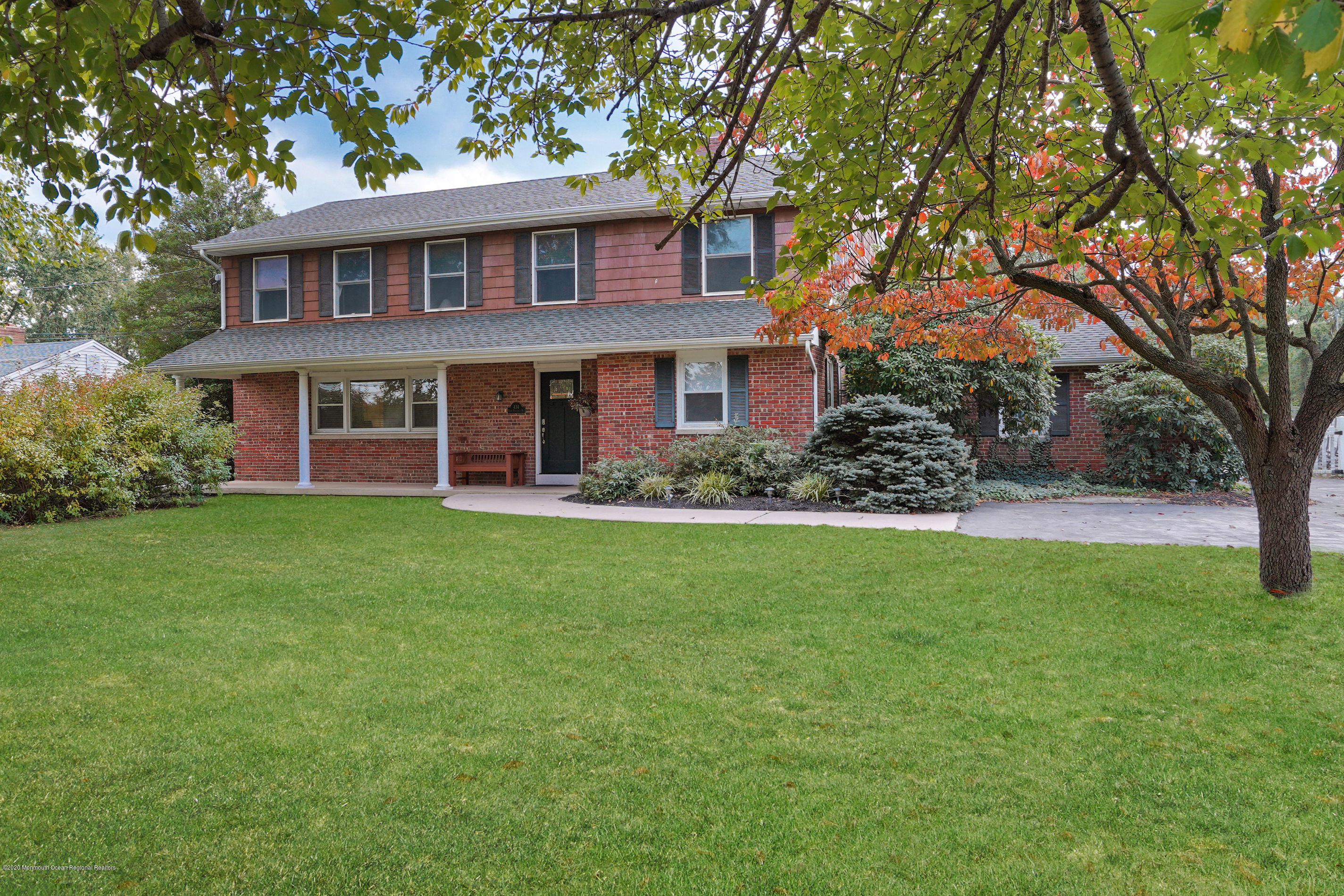 front view of a house with a yard