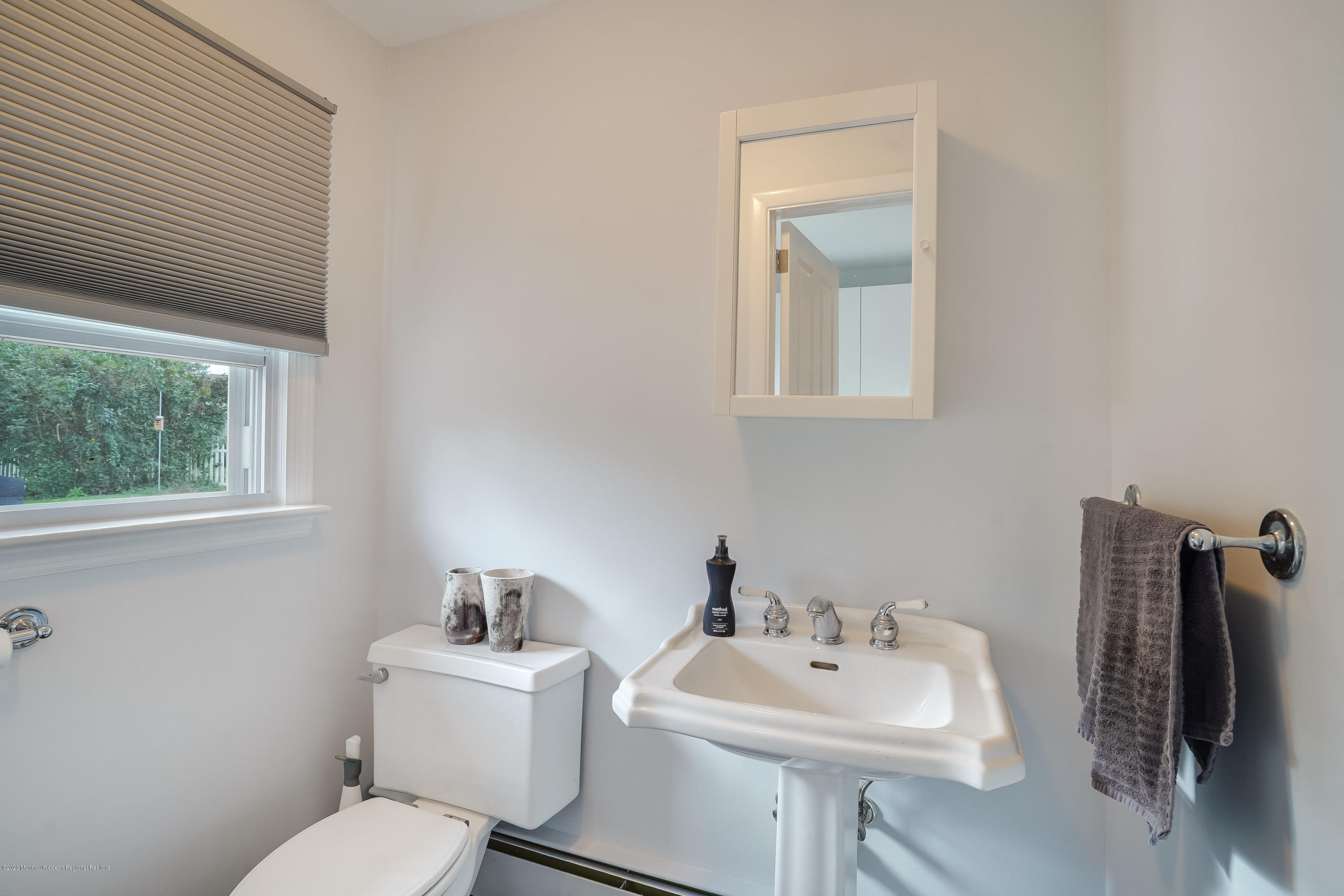 434 East Freehold Road Freehold, NJ 07728 - Photo 14 of 29 a bathroom with a sink mirror and toilet