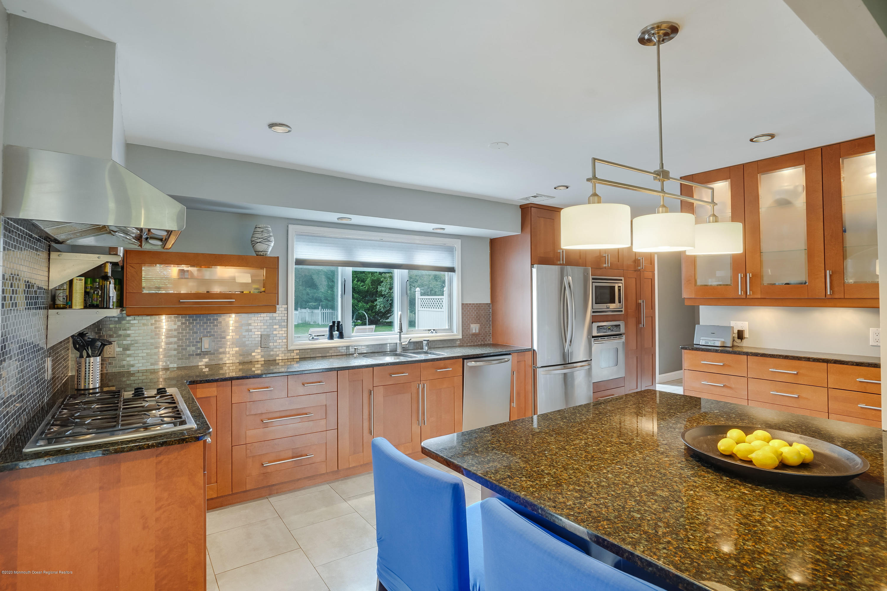434 East Freehold Road Freehold, NJ 07728 - Photo 8 of 29 a kitchen with stainless steel appliances granite countertop a sink and a stove