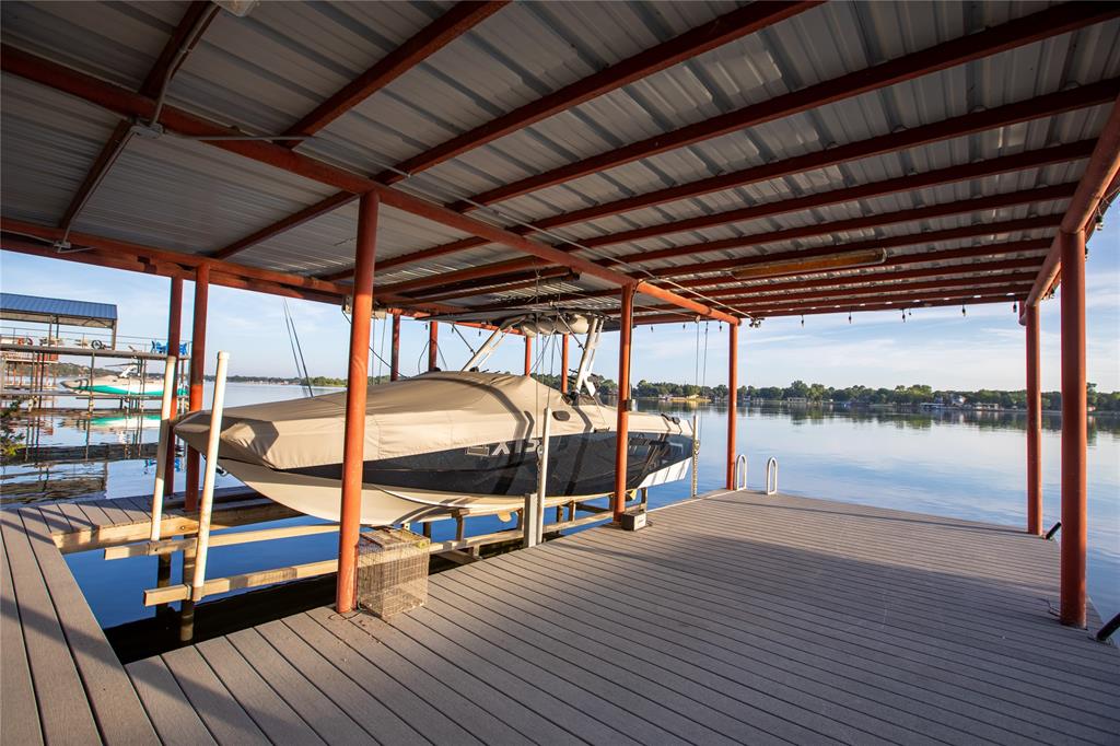 2702 River Ridge Court Granbury, TX 76048 - Photo 16 of 21 Dock area featuring boat lift and a water view