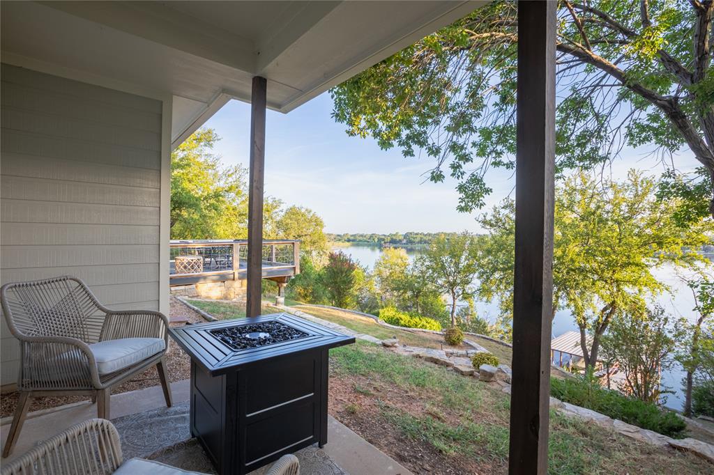 2702 River Ridge Court Granbury, TX 76048 - Photo 18 of 21 View of patio featuring a water view