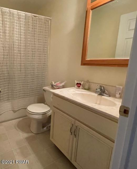 184 Skyview Road Dingmans Ferry, PA 18328 - Photo 16 of 26 a bathroom with a sink a toilet and a mirror