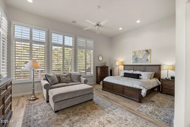 a spacious bedroom with a bed and a couch