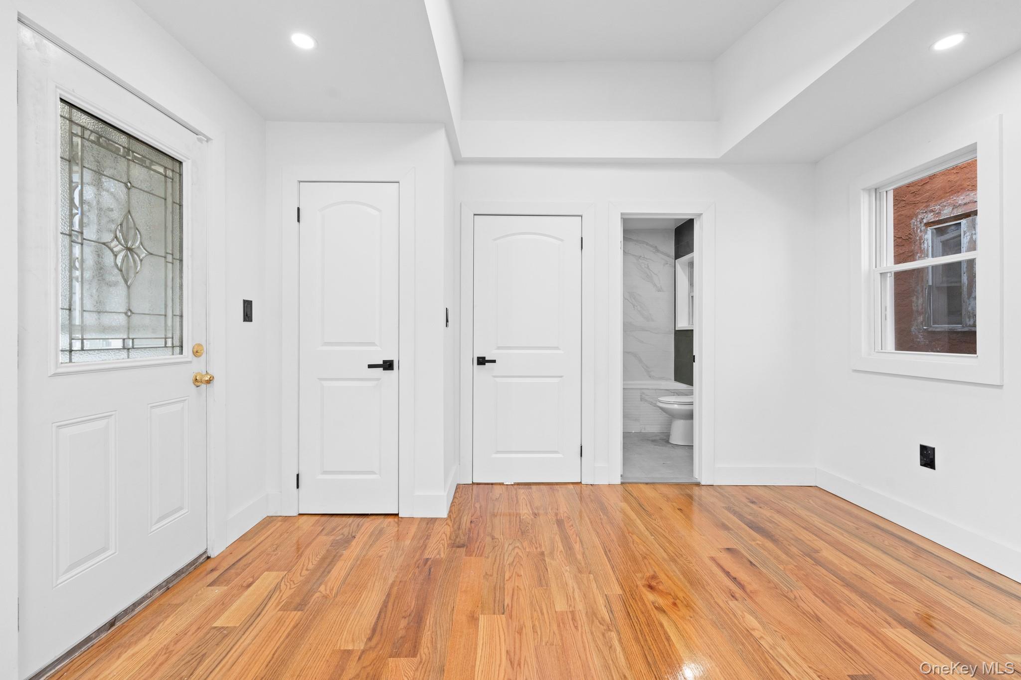 115-39 202nd Street Queens, NY 11412 - Photo 22 of 29 Foyer featuring plenty of natural light, light wood-style floors, and recessed lighting