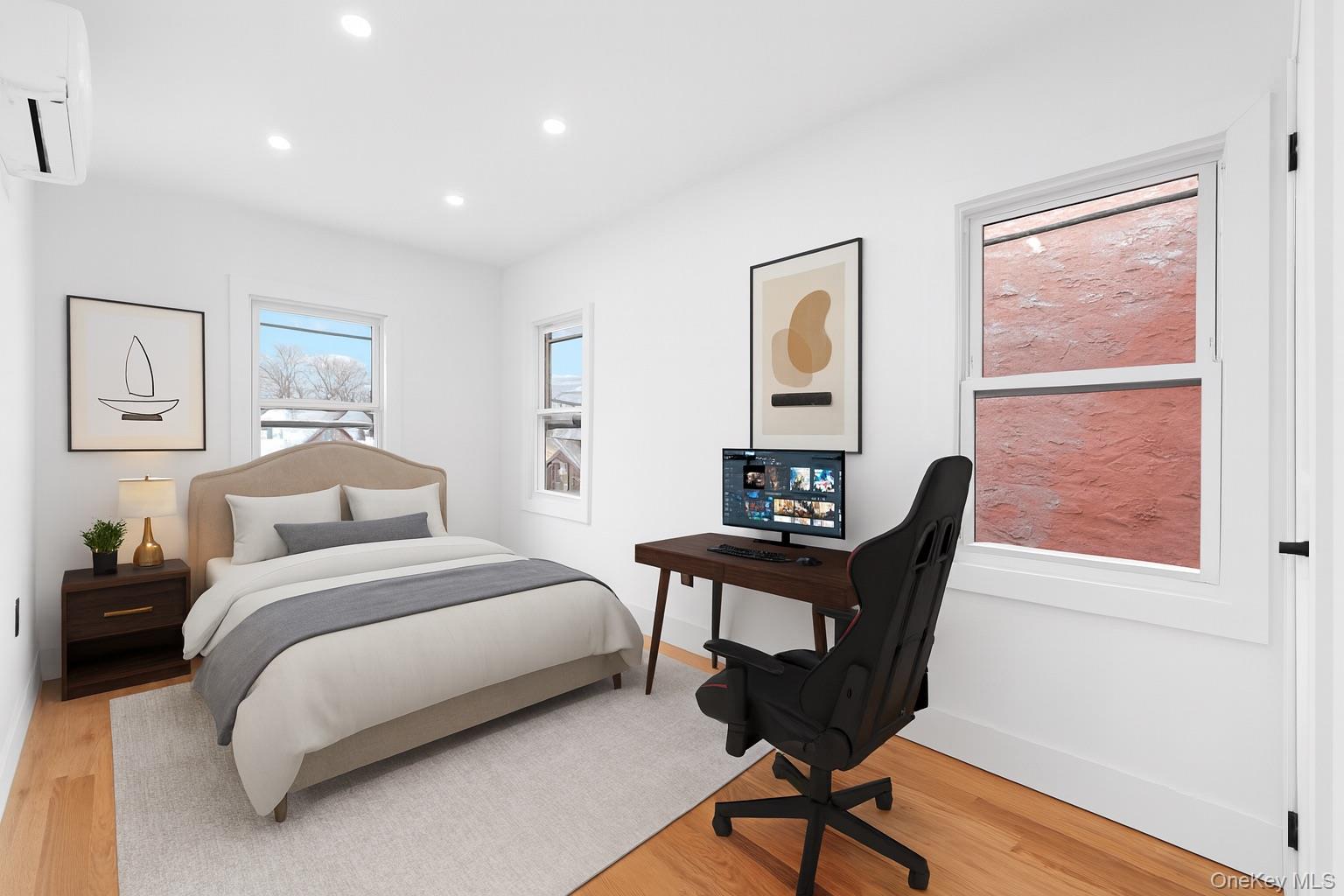 115-39 202nd Street Queens, NY 11412 - Photo 24 of 29 Bedroom with light wood-style floors, a wall mounted AC, and recessed lighting