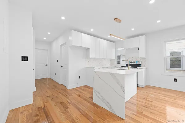 a view of kitchen with wooden floor