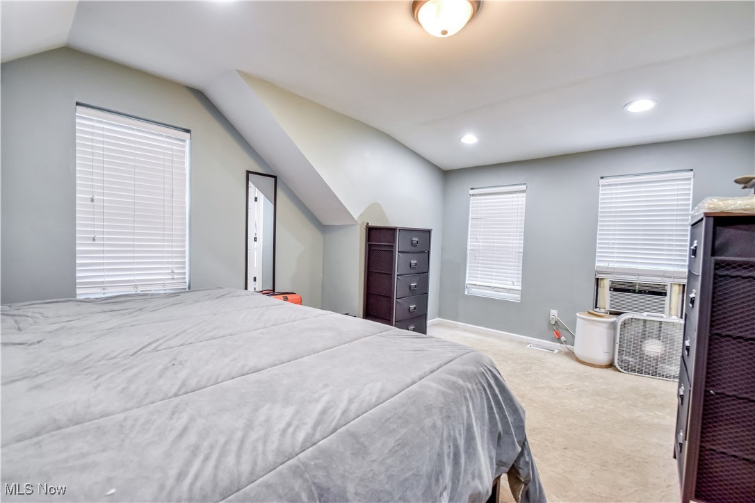 8115 Stockbridge Road Mentor, OH 44060 - Photo 32 of 46 Carpeted bedroom featuring lofted ceiling and recessed lighting
