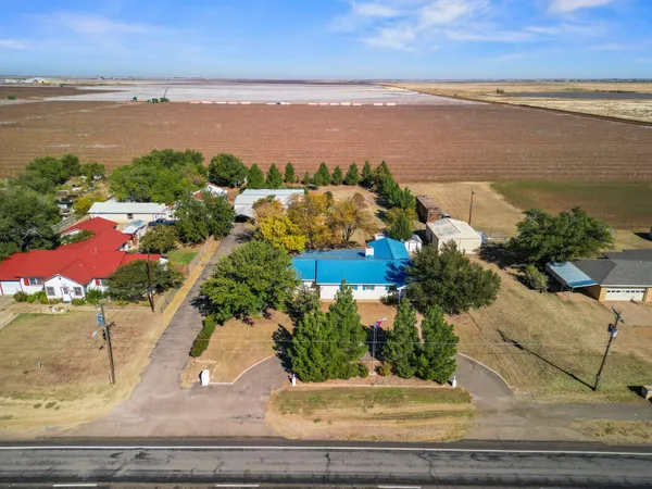 an aerial view of house with yard