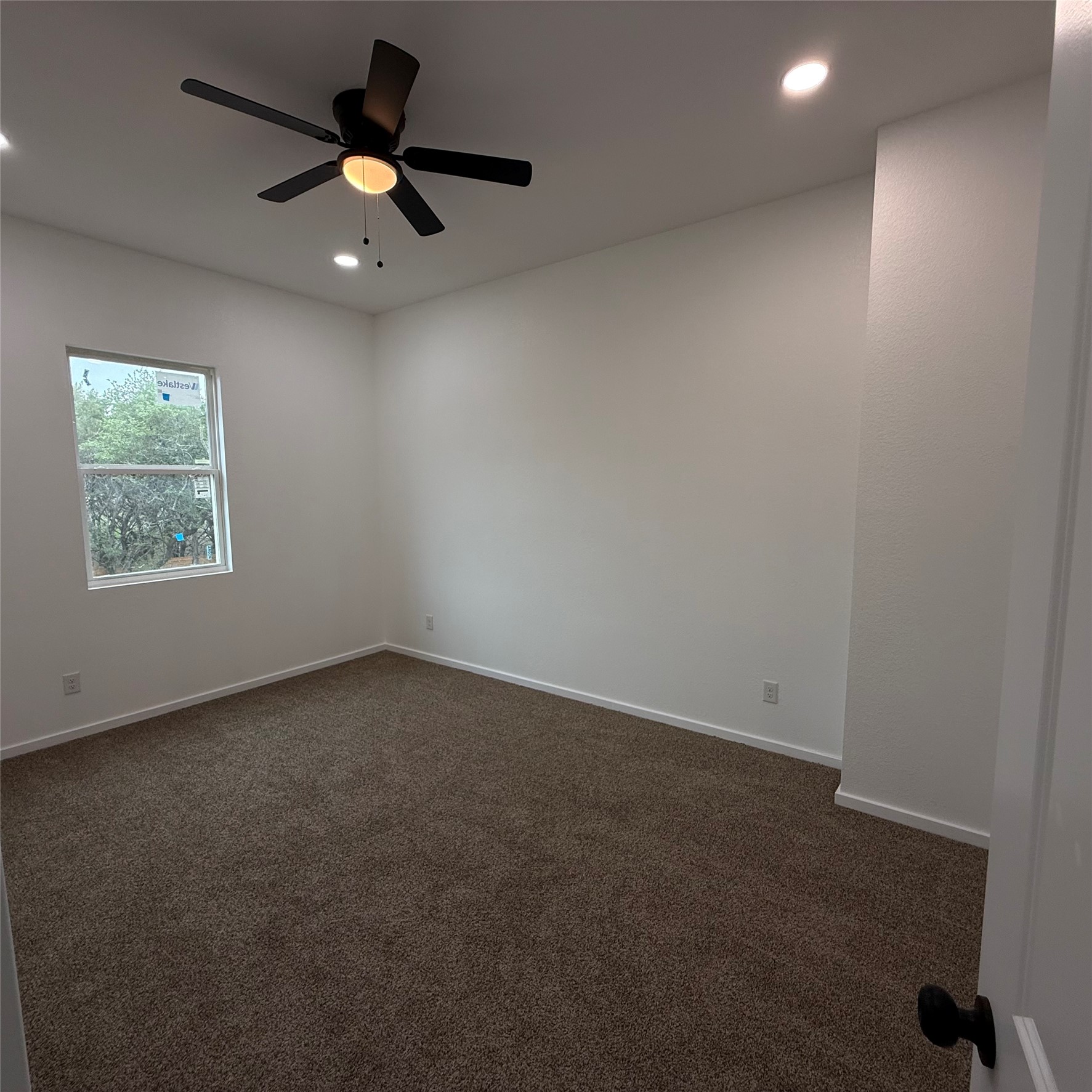 118 Crazy Cross Road Wimberley, TX 78676 - Photo 12 of 18 an empty room with a window and a fan