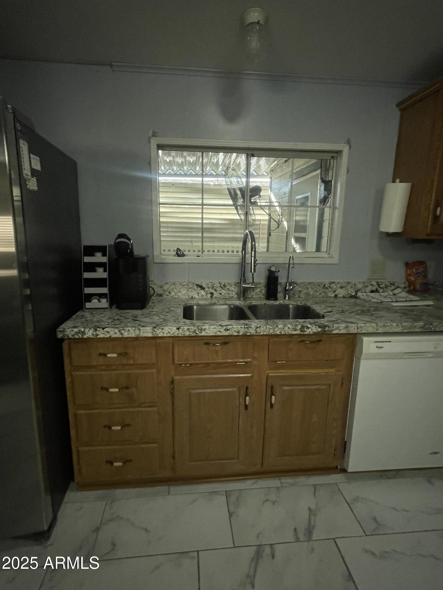 2100 North Trekell Road, Unit 254 Casa Grande, AZ 85122 - Photo 11 of 27 a bathroom with a granite countertop sink and a mirror