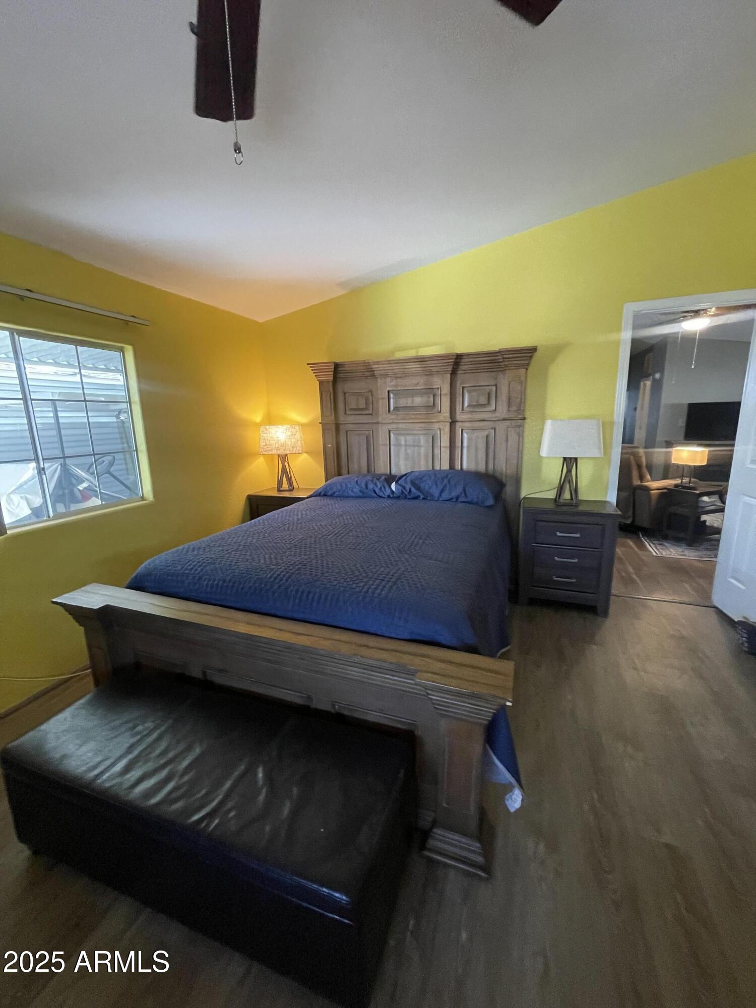 2100 North Trekell Road, Unit 254 Casa Grande, AZ 85122 - Photo 13 of 27 a bedroom with a bed and a couch