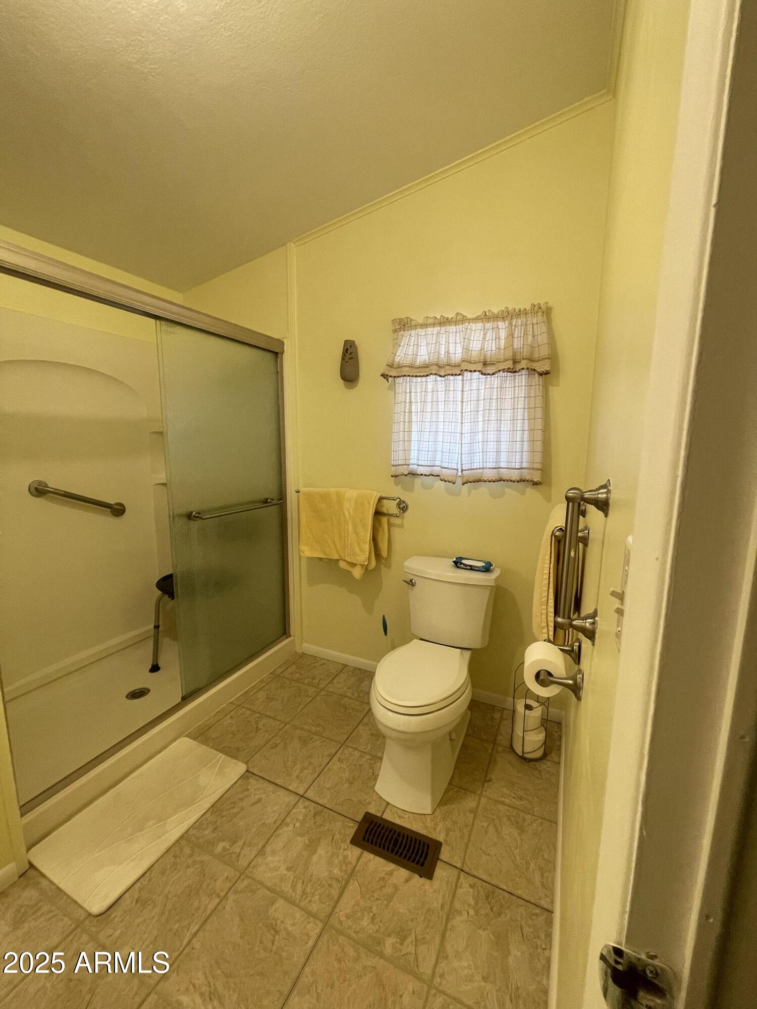 2100 North Trekell Road, Unit 254 Casa Grande, AZ 85122 - Photo 15 of 27 a bathroom with a toilet and a shower