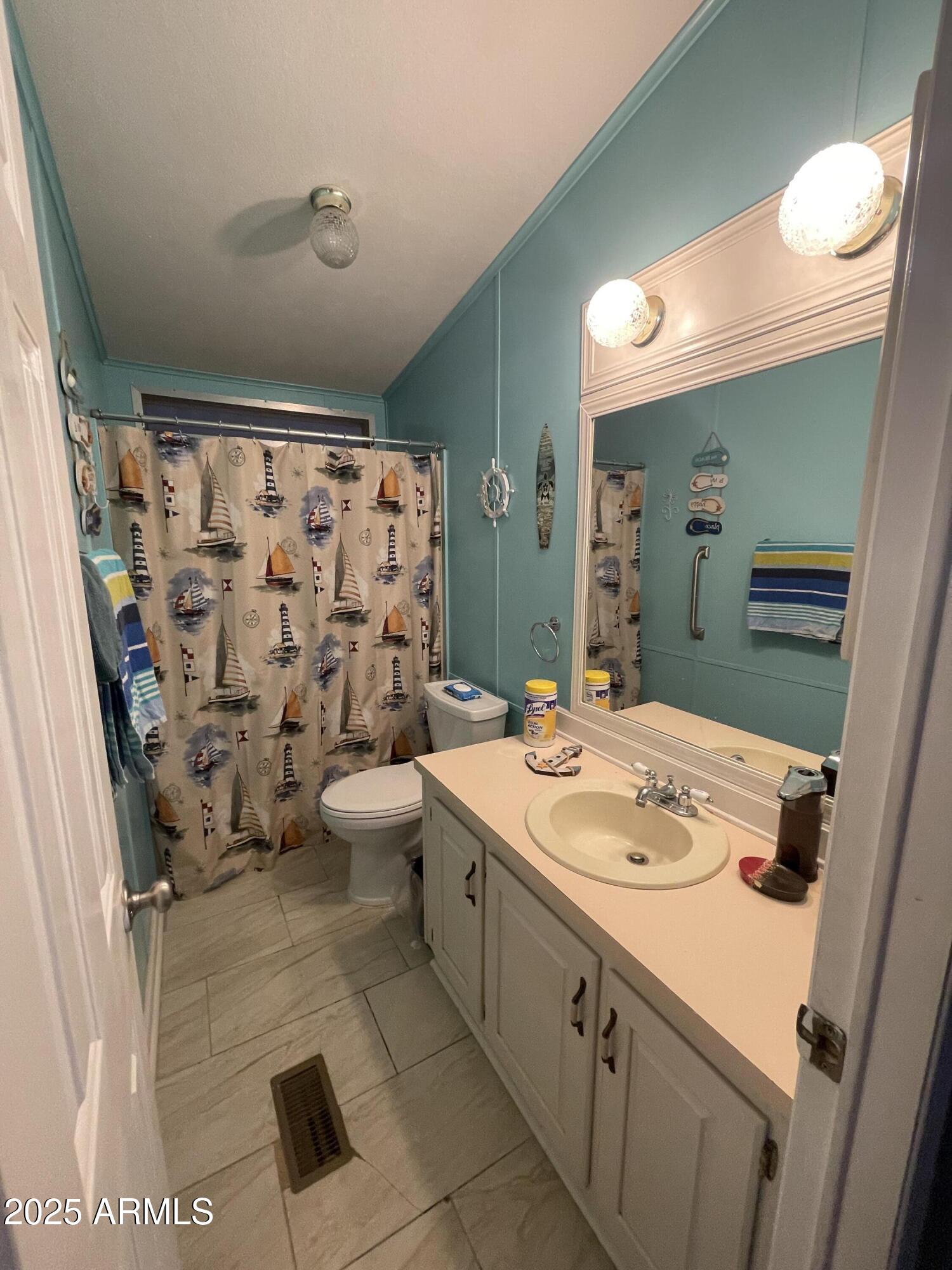 2100 North Trekell Road, Unit 254 Casa Grande, AZ 85122 - Photo 19 of 27 a bathroom with a sink a toilet and shower