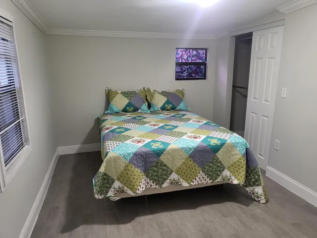 a room with pool table and windows