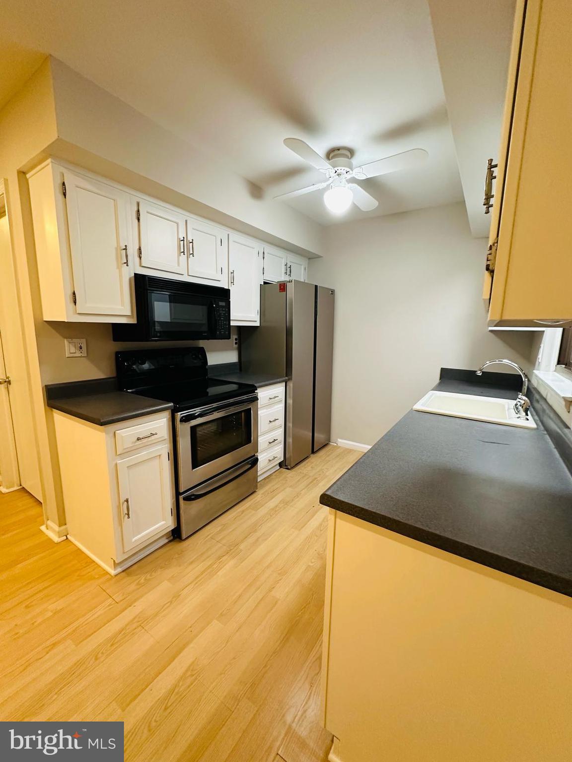 33 Trowbridge Lane Clementon, NJ 08021 - Photo 6 of 20 a kitchen with kitchen island a sink appliances and cabinets