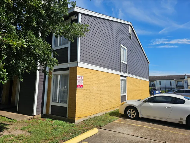 a view of a car in front of a house