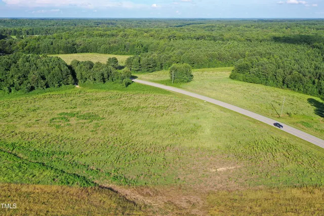 a view of a field with an ocean