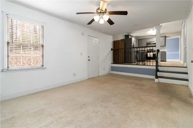 a view of an empty room with a window