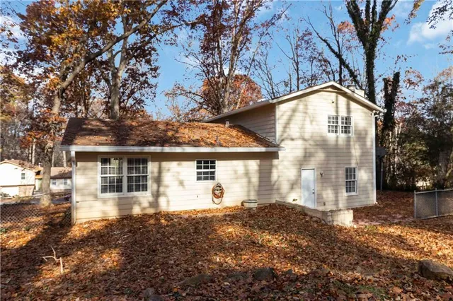 a view of house with yard