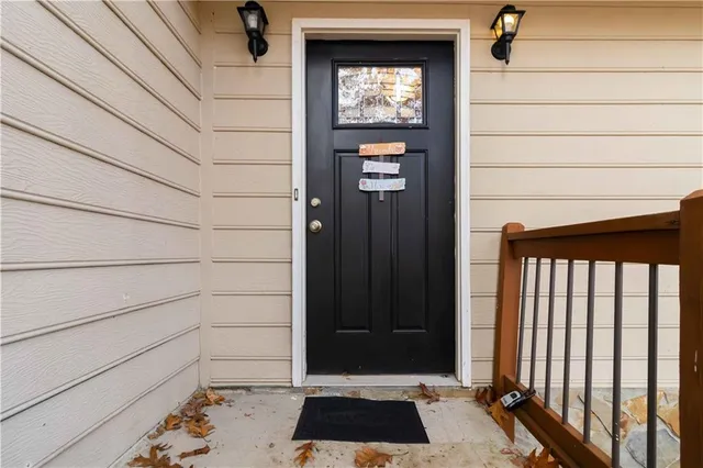 a view of a door and wooden floor