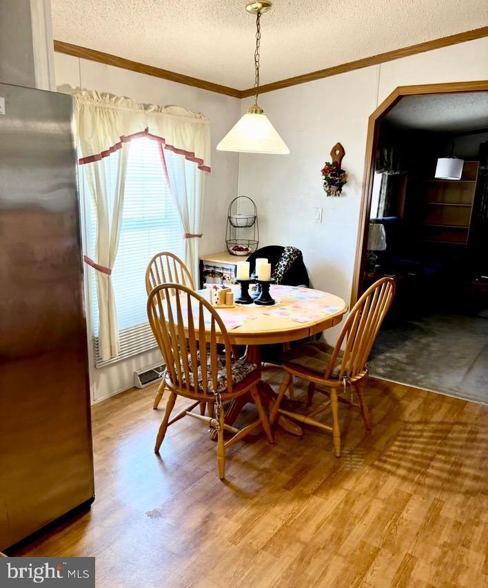 148 1st Street Lothian, MD 20711 - Photo 11 of 29 a dining room with furniture and wooden floor