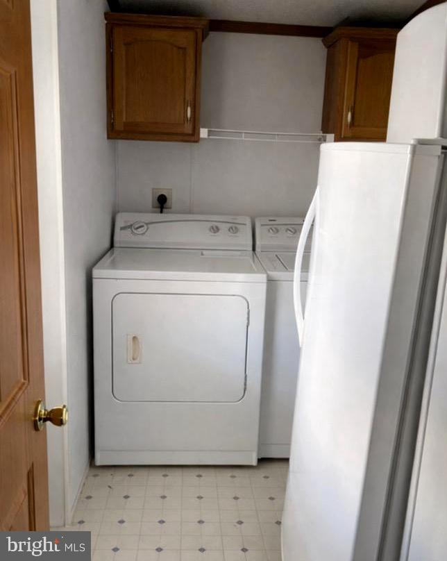 148 1st Street Lothian, MD 20711 - Photo 16 of 29 a utility room with dryer and washer