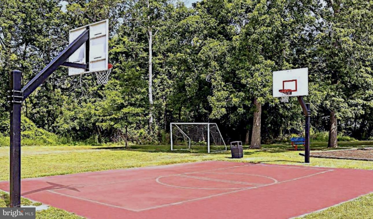 148 1st Street Lothian, MD 20711 - Photo 29 of 29 a view of a tennis ground with large trees