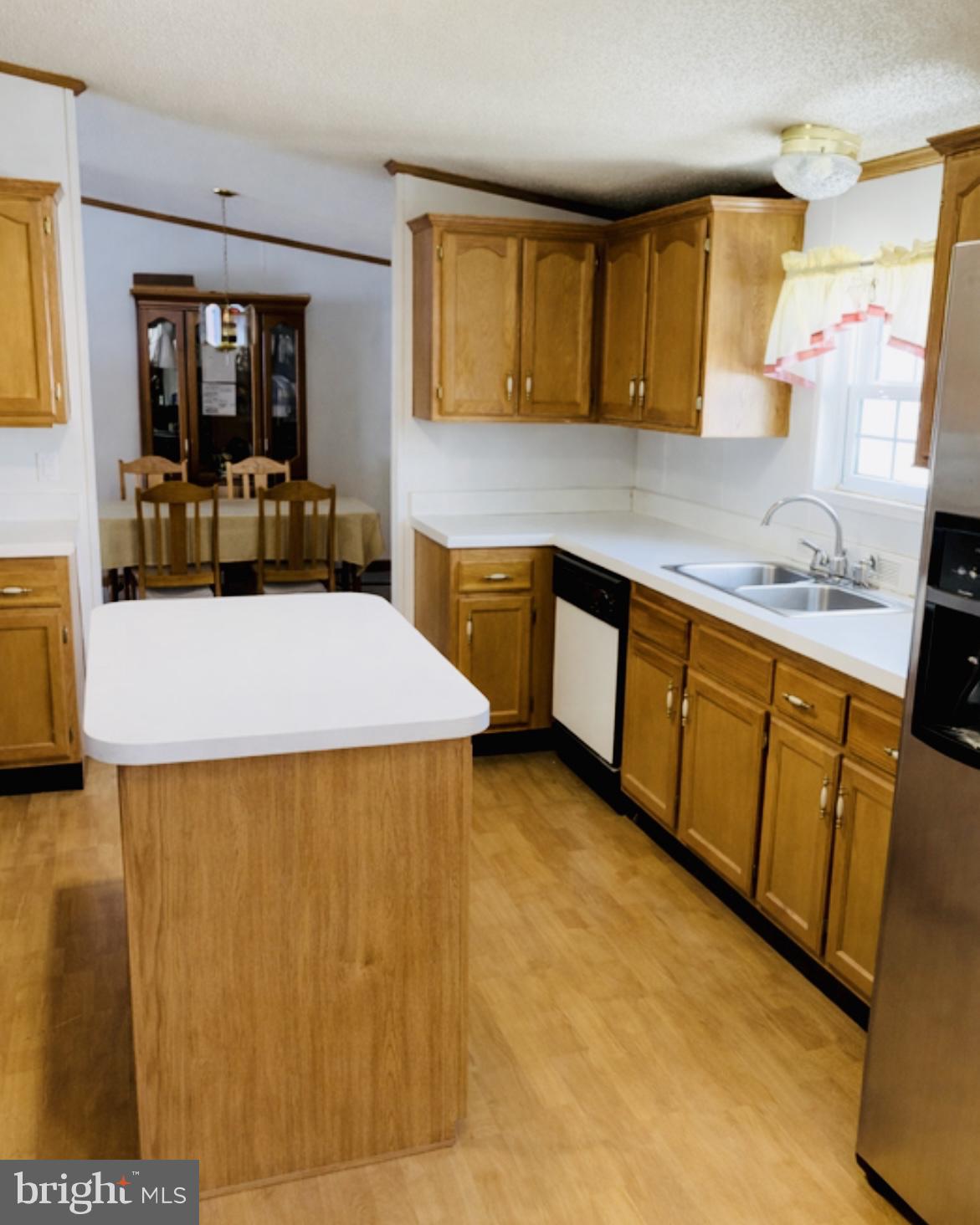 148 1st Street Lothian, MD 20711 - Photo 6 of 29 a kitchen with stainless steel appliances a stove a sink and a microwave