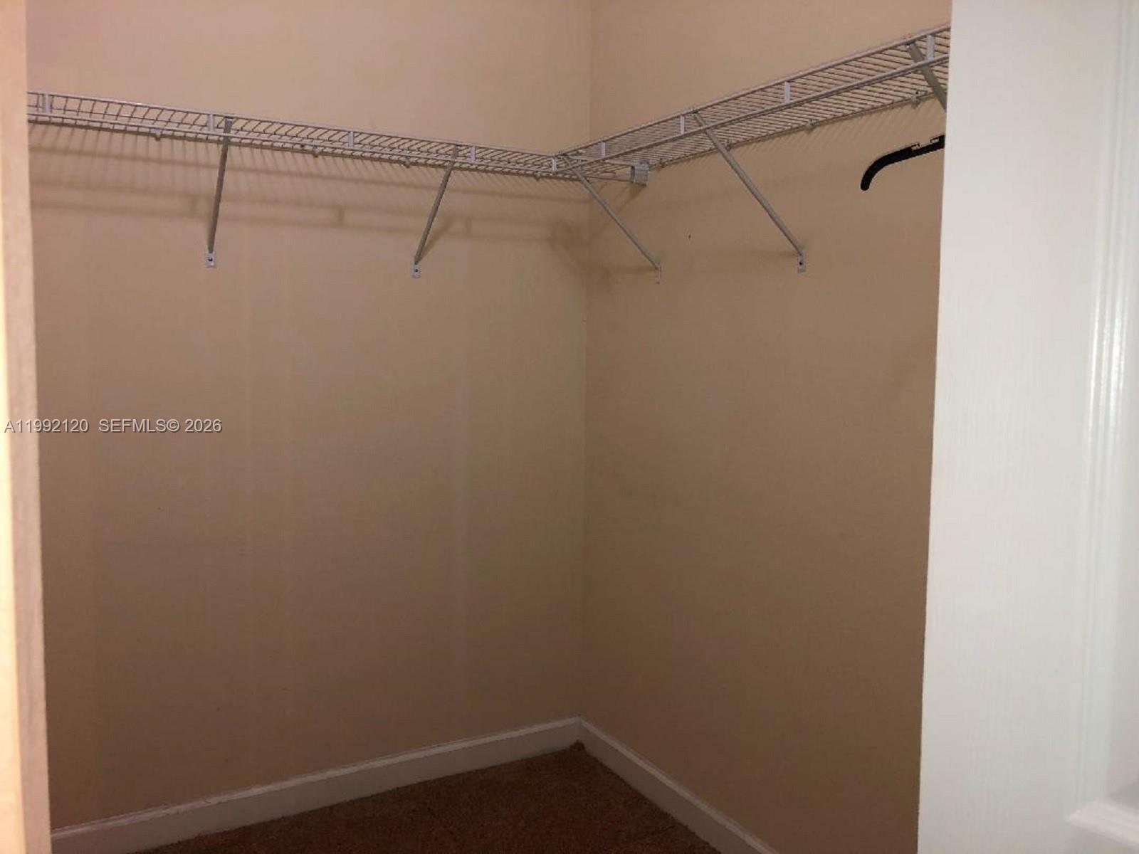17000 Southwest 90th Terrace Miami, FL 33196 - Photo 21 of 56 a view of a room with racks on the wall