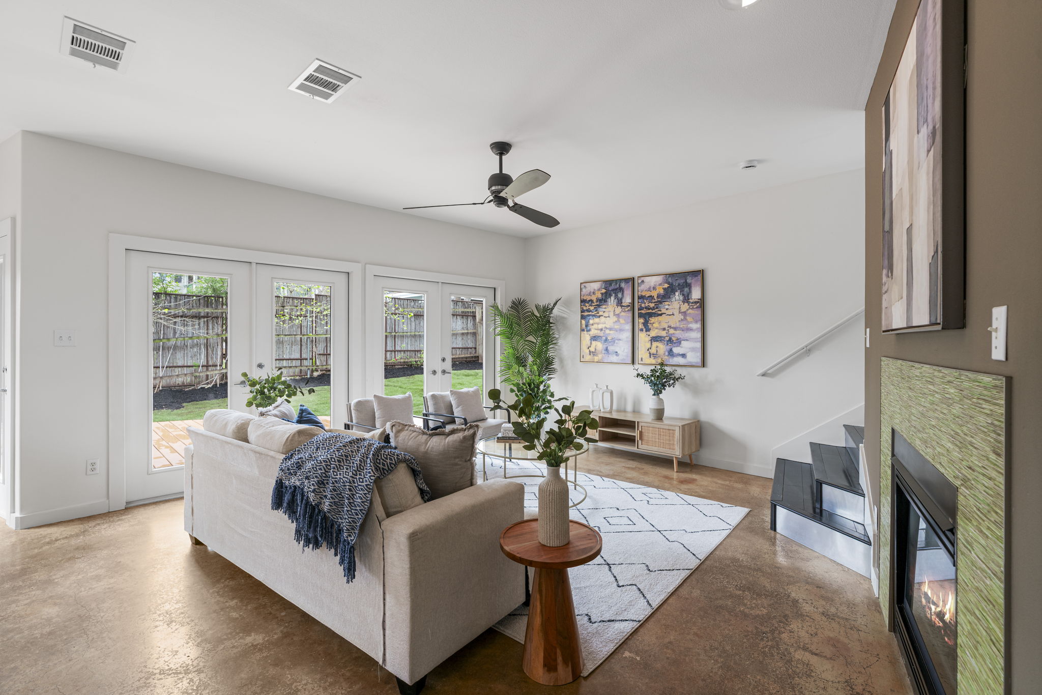 2114 Goodrich Avenue, Unit 10 Austin, TX 78704 - Photo 11 of 35 The open living space welcomes you with natural light, warm wood floors, and a relaxed atmosphere perfect for unwinding after a day exploring the best of Zilker.