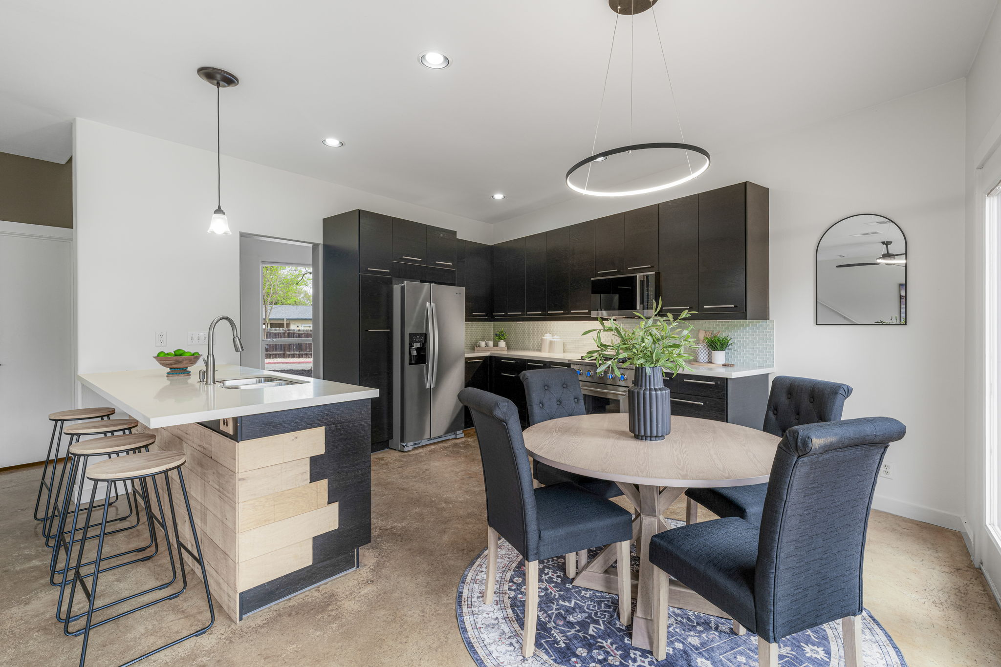 2114 Goodrich Avenue, Unit 10 Austin, TX 78704 - Photo 18 of 35 Natural light fills the dining space, offering an inviting setting for meals and conversation.
