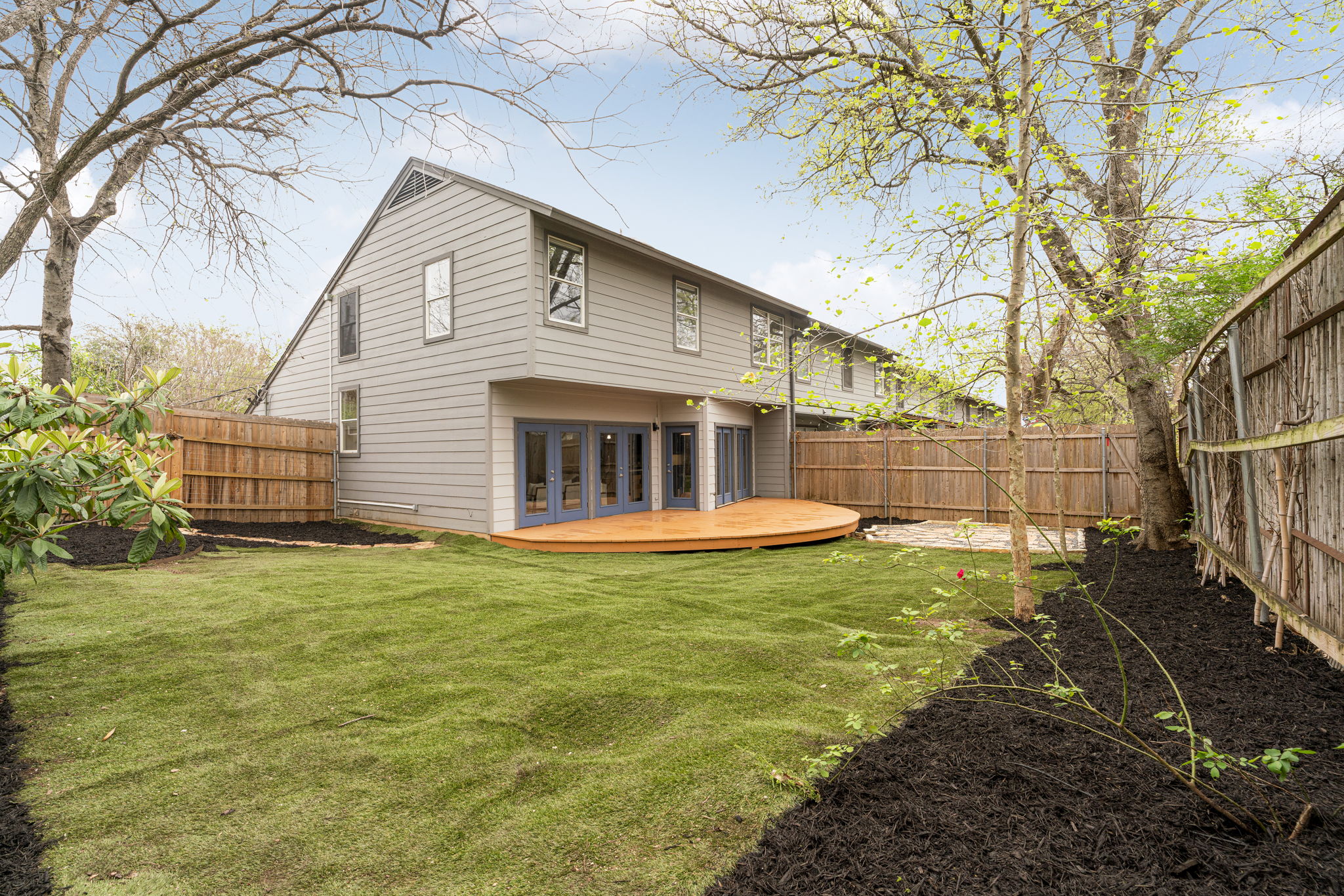 2114 Goodrich Avenue, Unit 10 Austin, TX 78704 - Photo 2 of 35 Tucked at the end of the intimate 10-unit community, this end-unit residence enjoys extra privacy and one of the most spacious backyards in the complex.